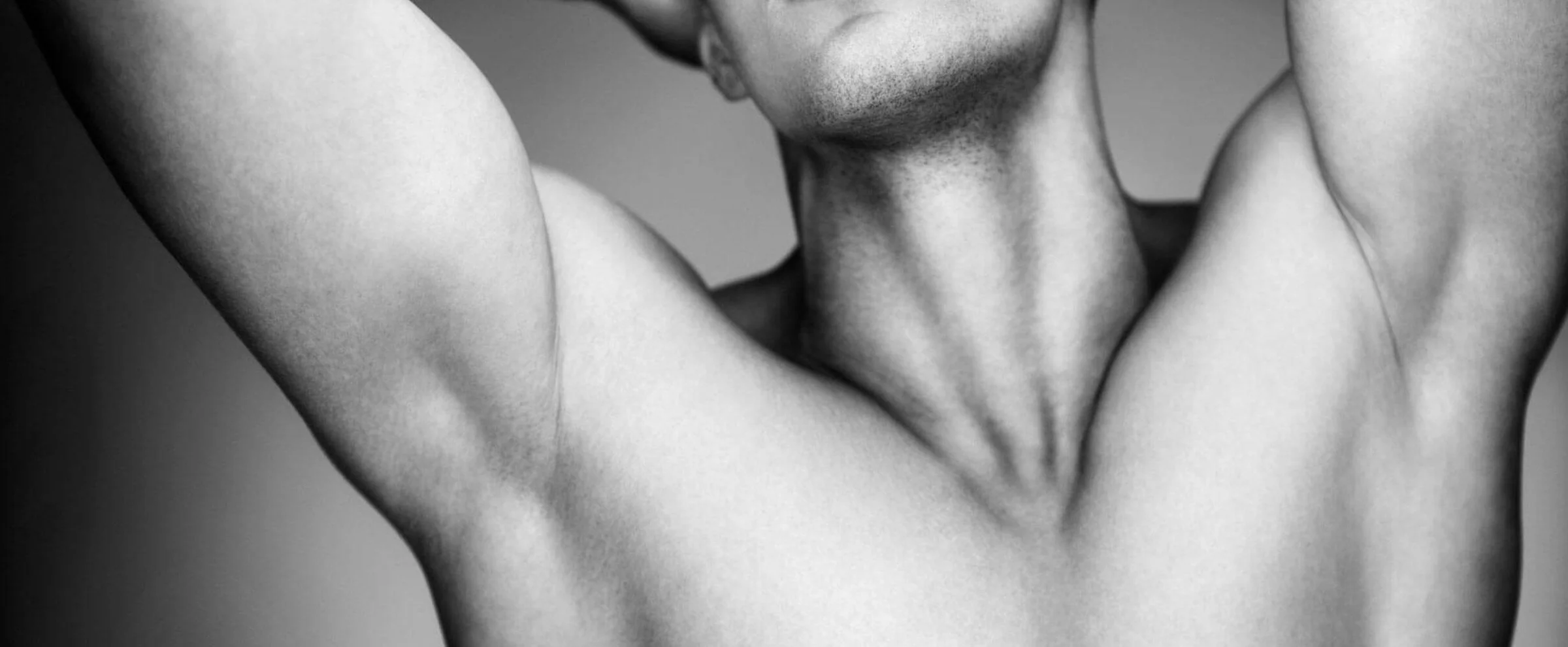 Close-up black and white image of underarm area for laser hair removal