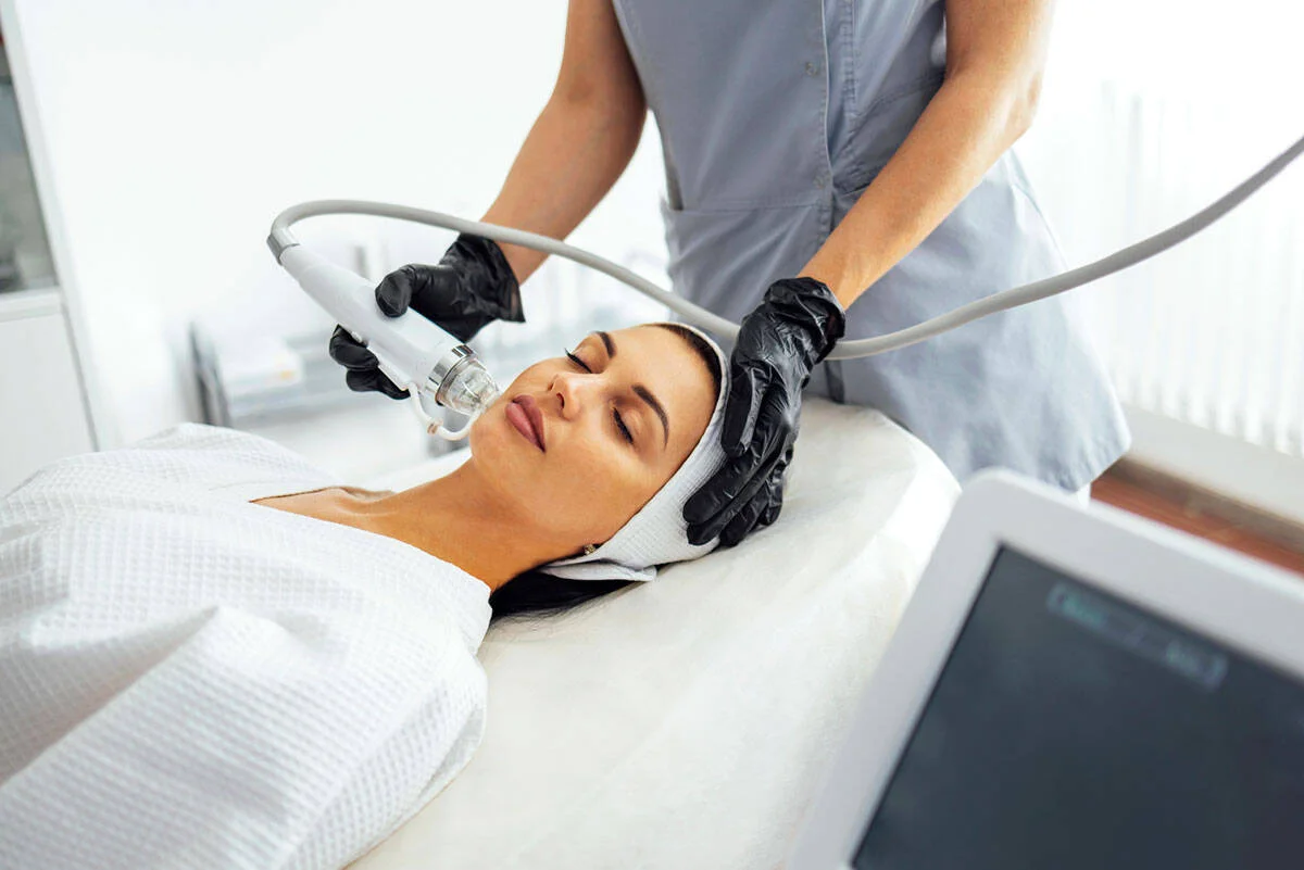 Radiofrequency microneedling treatment being performed on a patient's face