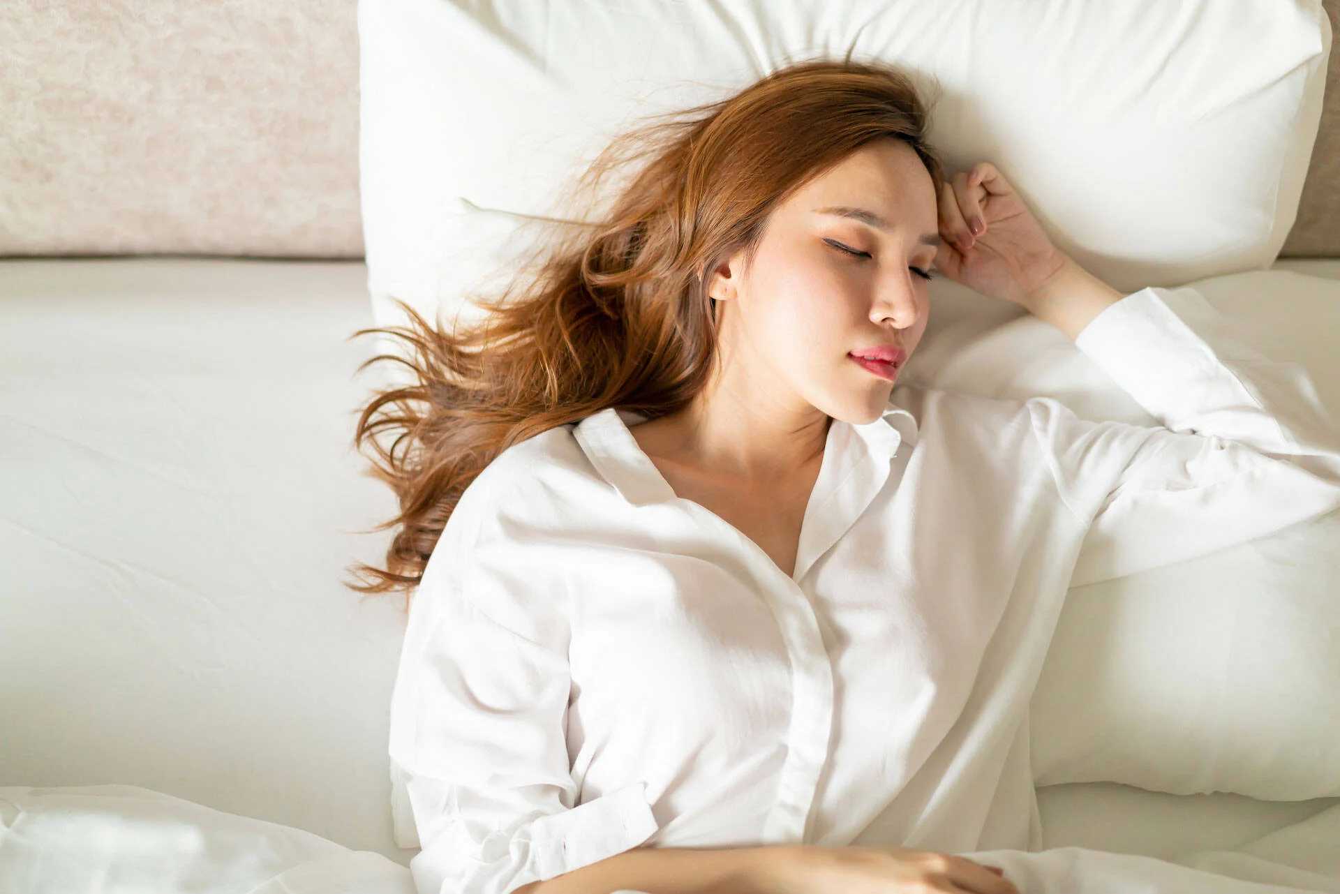 Woman sleeping peacefully in bed