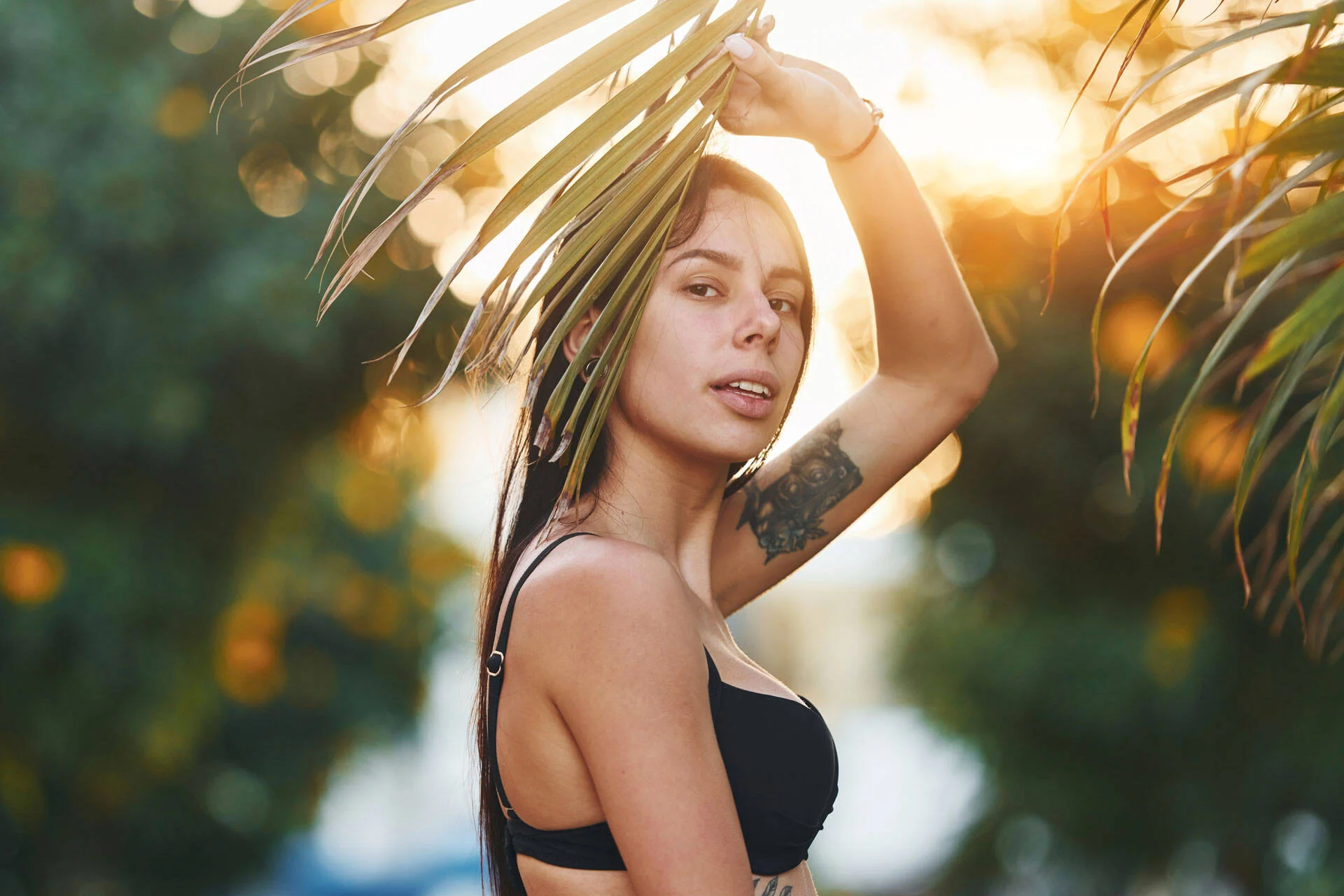 Woman outdoors with a visible tattoo on her arm